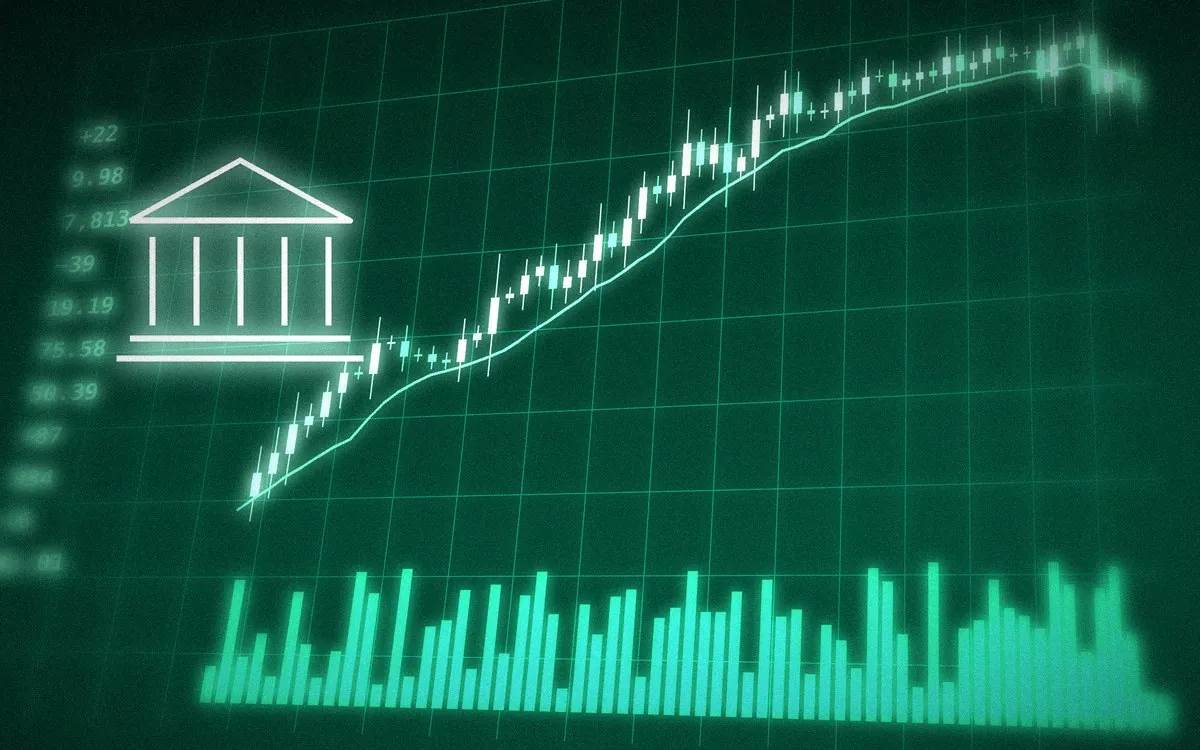 銀行のマークと上昇する銀行株のチャートのイメージ